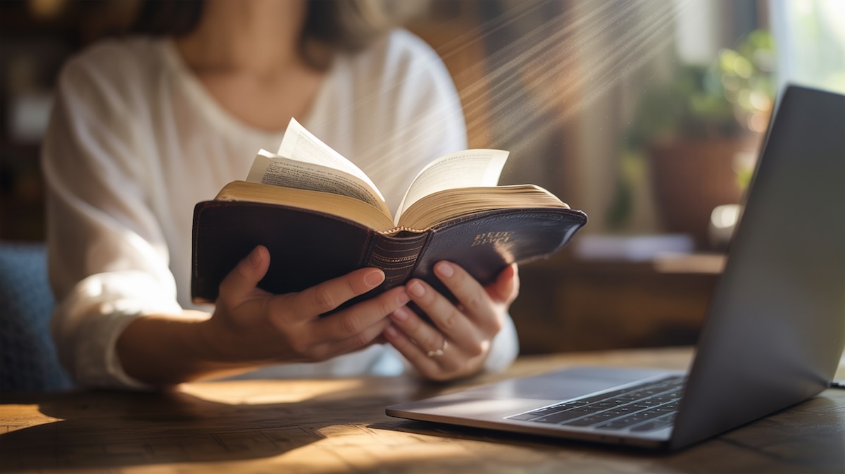 Bible verses for employment breakthrough with hands holding open scripture and divine light